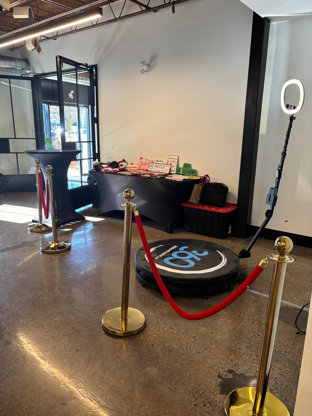 360 video booth with stanchions and props