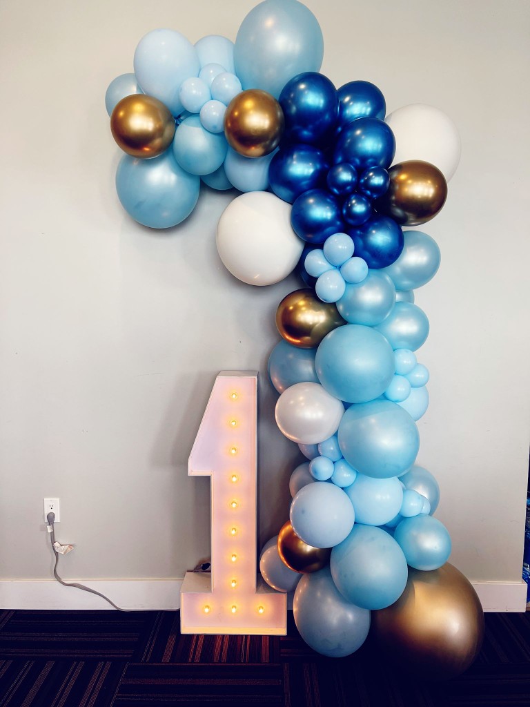 balloon garland and a marquee number