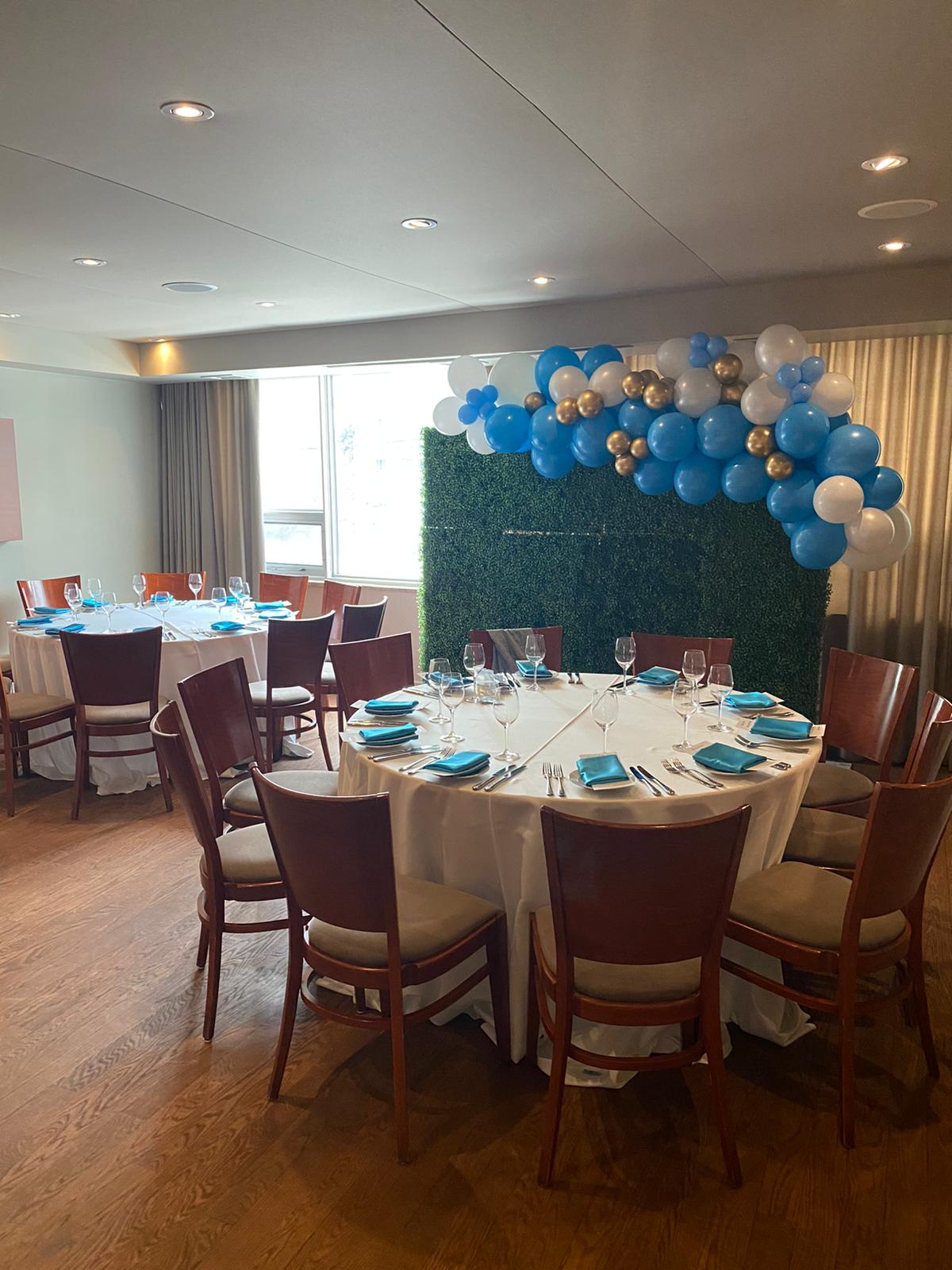 event furniture, green boxwood wall and balloon garland