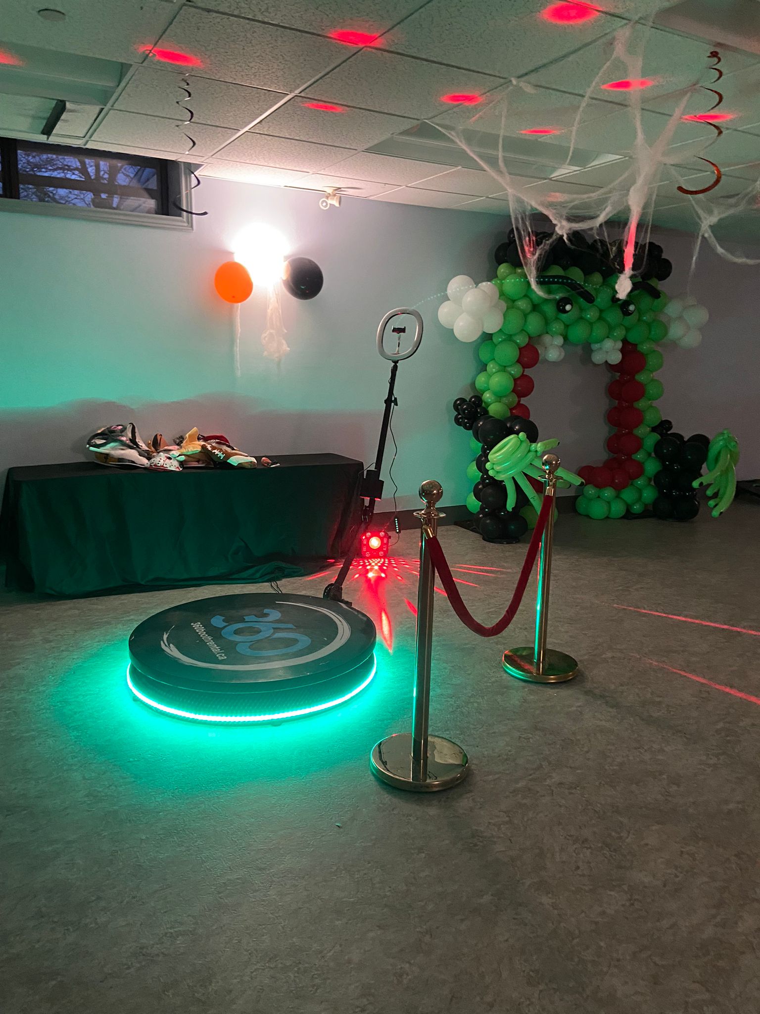 balloon decor and stanchions with a 360 video booth rental