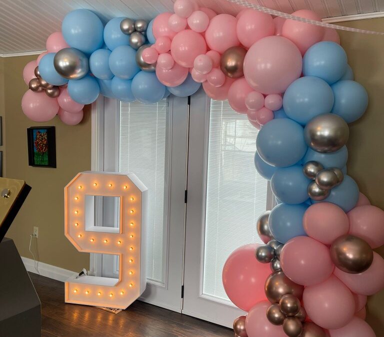marquee number and balloon arch