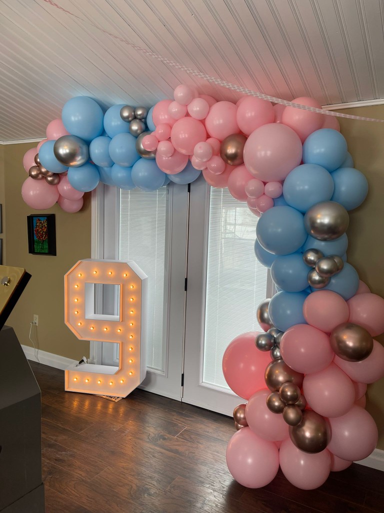 marquee number and balloon arch 